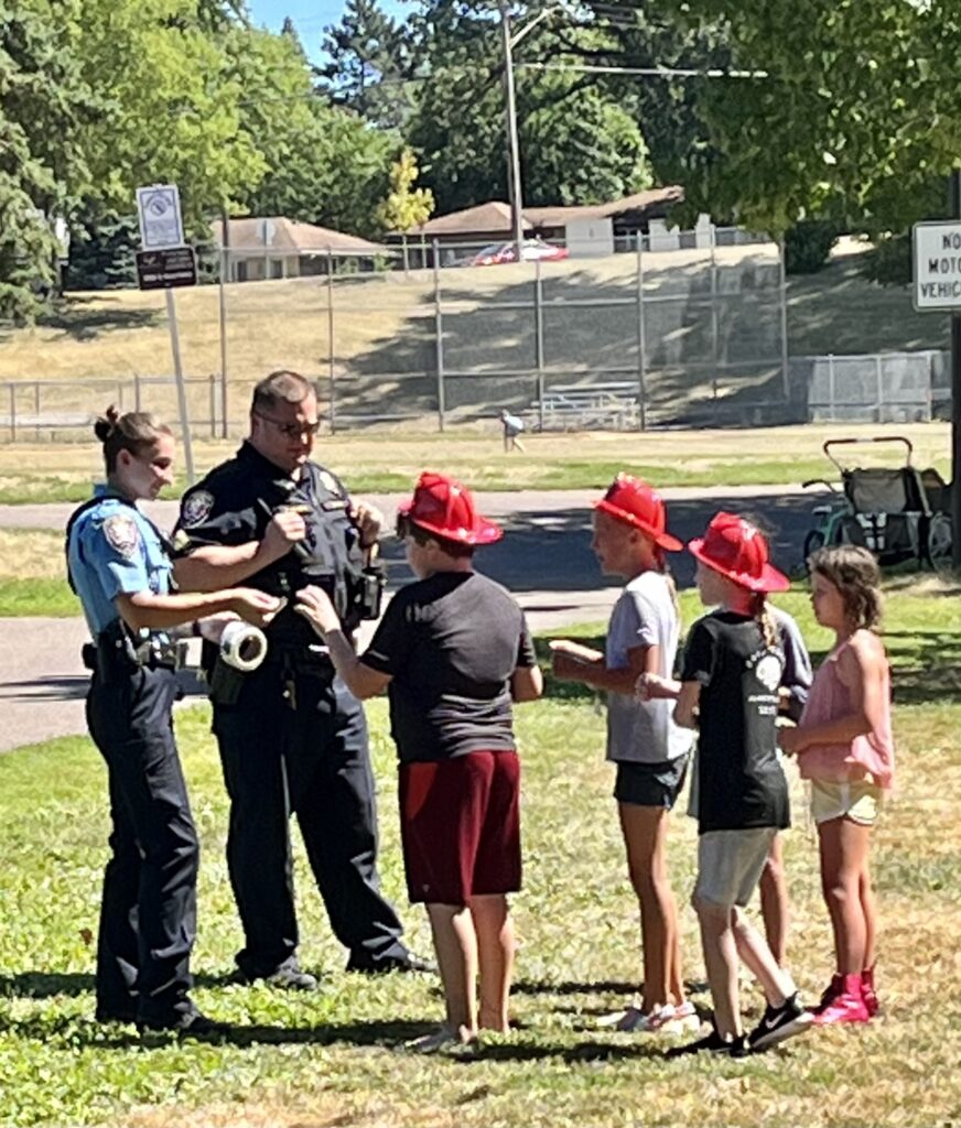 officers with kids at event