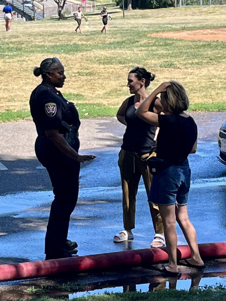 officer with parents at event